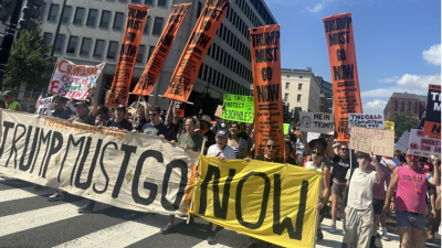 Refuse Fascism banner leads march in Washington DC, August 16, 2025.